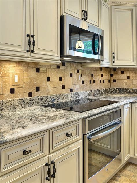 white cabinets with marble backsplash